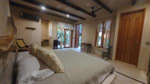Postel nebo postele na pokoji v ubytování La Casa de Mia Holbox