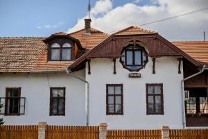 a white house with a brown roof at GouldVilla Vendégház in Villány