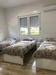 Postel nebo postele na pokoji v ubytování Soba Milojkovic + 27 fotografií
