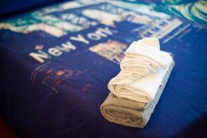 a towel is sitting on top of a bed at Antadia in Palermo