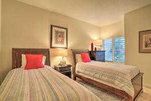 a bedroom with two beds and a window at Palm Desert Country Club Home with Pool Access! in Palm Desert +21 photos