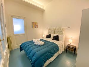 A bed or beds in a room at Le Casette di Piazza Borsa