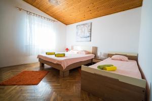 Postel nebo postele na pokoji v ubytování Apartman Josipa