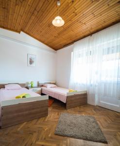 Postel nebo postele na pokoji v ubytování Apartman Josipa