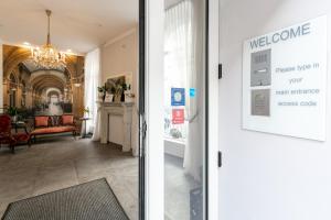 a door to a hallway with a view of a living room at Room 55 in Vienna