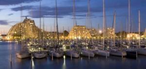 a group of boats docked in a marina at night at Entre Terre et Mer in Marsillargues
