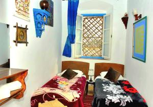Postel nebo postele na pokoji v ubytování Appart, Hotel & Café Agadir