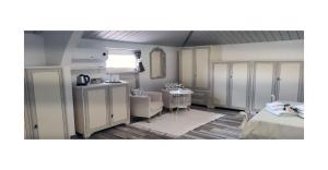 a room with a bed and a room with a table at Il Pittore di Stelle B&B in Boissano