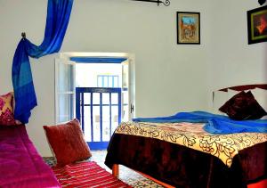 Postel nebo postele na pokoji v ubytování Appart, Hotel & Café Agadir