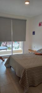 En eller flere senge i et værelse på Kenty Salta