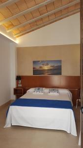 Postel nebo postele na pokoji v ubytování HOTEL ISLA PLANA