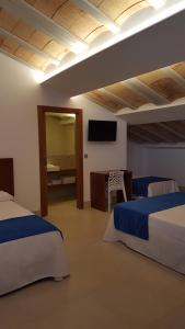 Postel nebo postele na pokoji v ubytování HOTEL ISLA PLANA