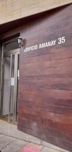 a wooden garage door with the words objota amway on it at The Summer Treat Shared Apartment Compartido in Corralejo