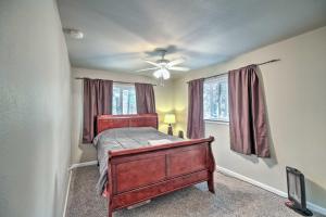 a bedroom with a bed and a ceiling fan at Peaceful Little Doll House Cabin with Grill! in Mi-Wuk Village