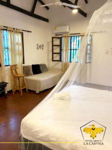 A bed or beds in a room at Hotel Minca - La Casona