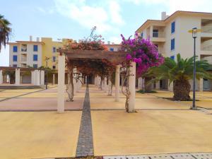 a street with a arch with flowers on it at Apartamento Privado Vila Verde in Santa Maria