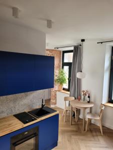 Kuchyňa alebo kuchynka v ubytovaní Cozy Corner Gdansk
