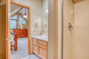 a bathroom with a sink and a mirror at Yankee Mountain 9 - Meredith Lodging in Sunriver +57 photos