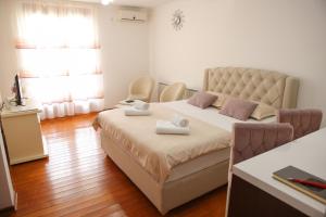 Postel nebo postele na pokoji v ubytování Apartman Pegasus