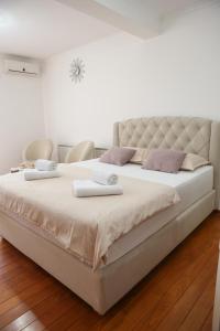 Postel nebo postele na pokoji v ubytování Apartman Pegasus
