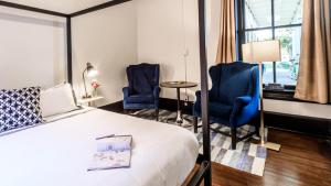 Postel nebo postele na pokoji v ubytování Hotel Giles