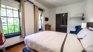Postel nebo postele na pokoji v ubytování Hotel Giles
