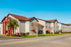 a rendering of a hotel on a street at Red Roof Inn & Suites Pensacola-NAS Corry in Pensacola