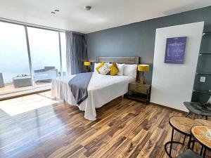 A bed or beds in a room at Hotel CLARUM 101