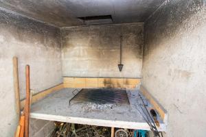 a dirty room with a bed in a wall at Apartments Calida A in Drage