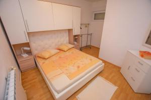 Ένα ή περισσότερα κρεβάτια σε δωμάτιο στο Apartments Calida A