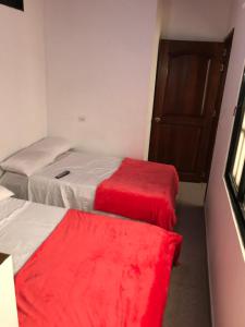 Postel nebo postele na pokoji v ubytování Hotel Buganvilla