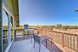 a balcony with a table and a grill on it at Near White Mountain Lake Home with Balcony and Patio in Show Low