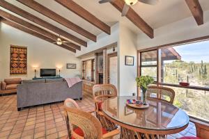 a living room with a table and chairs and a couch at Beautiful Saguaro Vista with Mountain Views! in Tucson