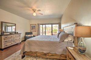 a bedroom with a bed and a ceiling fan at Beautiful Saguaro Vista with Mountain Views! in Tucson +23 photos