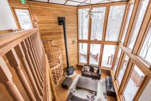 an overhead view of a living room with wooden walls at Midori House - walking distance to Rusutsu Resort in Rusutsu