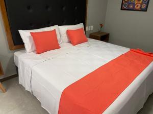Postel nebo postele na pokoji v ubytování HIT Merida Hotel Boutique