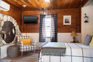 Ліжко або ліжка в номері Lakewood Cabins