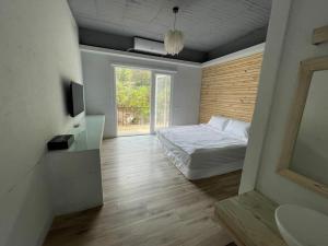 Ένα ή περισσότερα κρεβάτια σε δωμάτιο στο Liangan