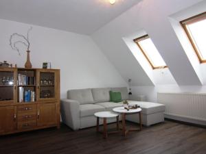 a living room with a couch and a table at Apartment at the Castle Square in Wolgast