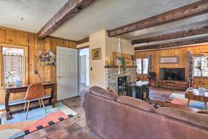a living room with a couch and a fireplace at Lake Cabin with King Bed, Foodie Kitchen, and Views in Twin Lakes
