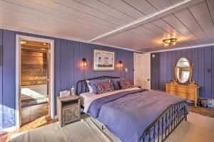 a bedroom with a bed and a mirror at Lake Cabin with King Bed, Foodie Kitchen, and Views in Twin Lakes +36 photos