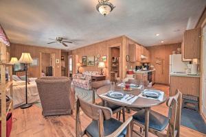 a kitchen and living room with a table and chairs at Secluded Indian River Retreat with Fire Pit! in Indian River