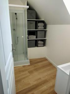 a bathroom with a shower and a walk in closet at Le125 in Saultain