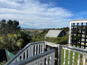 a view from the deck of a house with a fence at The Jazz Loft in Onetangi