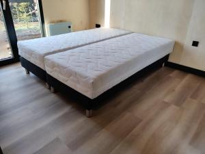 Ένα ή περισσότερα κρεβάτια σε δωμάτιο στο Tiny house XXL