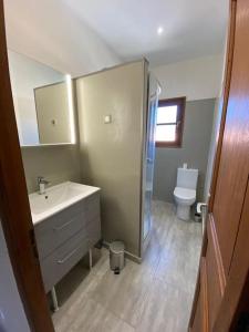 a bathroom with a sink and a toilet at Levé du soleil sur la mer in Taglio-Isolaccio