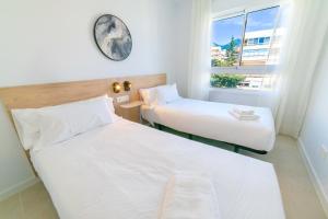 Aqua Apartments Bellamar, Marbella客房内的一张或多张床位