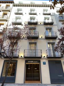 a white building with balconies on the side of it at VTZ Hotel San Valero in Zaragoza