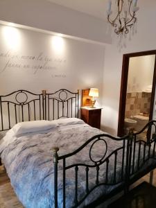 a bedroom with a bed with a quote on the wall at La Dimora del Conte in Pescara