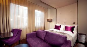Postel nebo postele na pokoji v ubytování Home Hotel Folketeateret